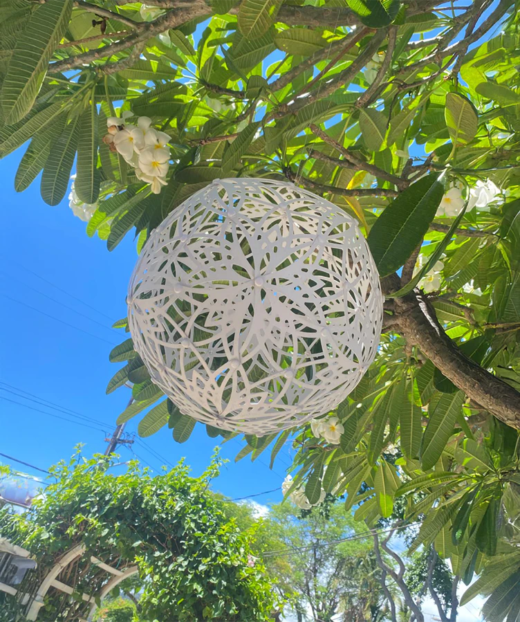 GlowTheory 12-inch Solar Lamp in White Lotus design with a unique spherical shape and solar-powered illumination