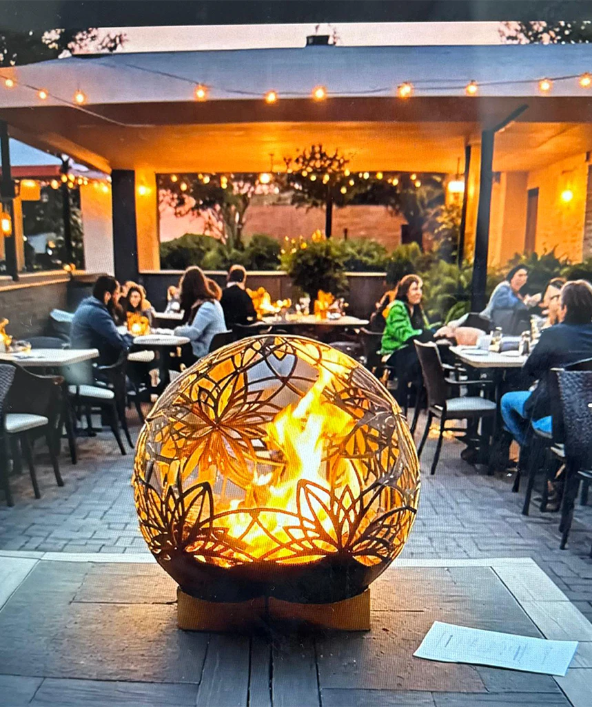 Striking Lotus Bonfireball Fire Pit designed for outdoor gatherings with durable steel construction and artistic detail