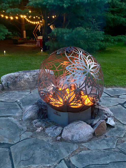 FlowerHouse 50-inch Lotus Bonfireball Fire Pit in durable stainless steel with detailed lotus carvings and an expansive open design