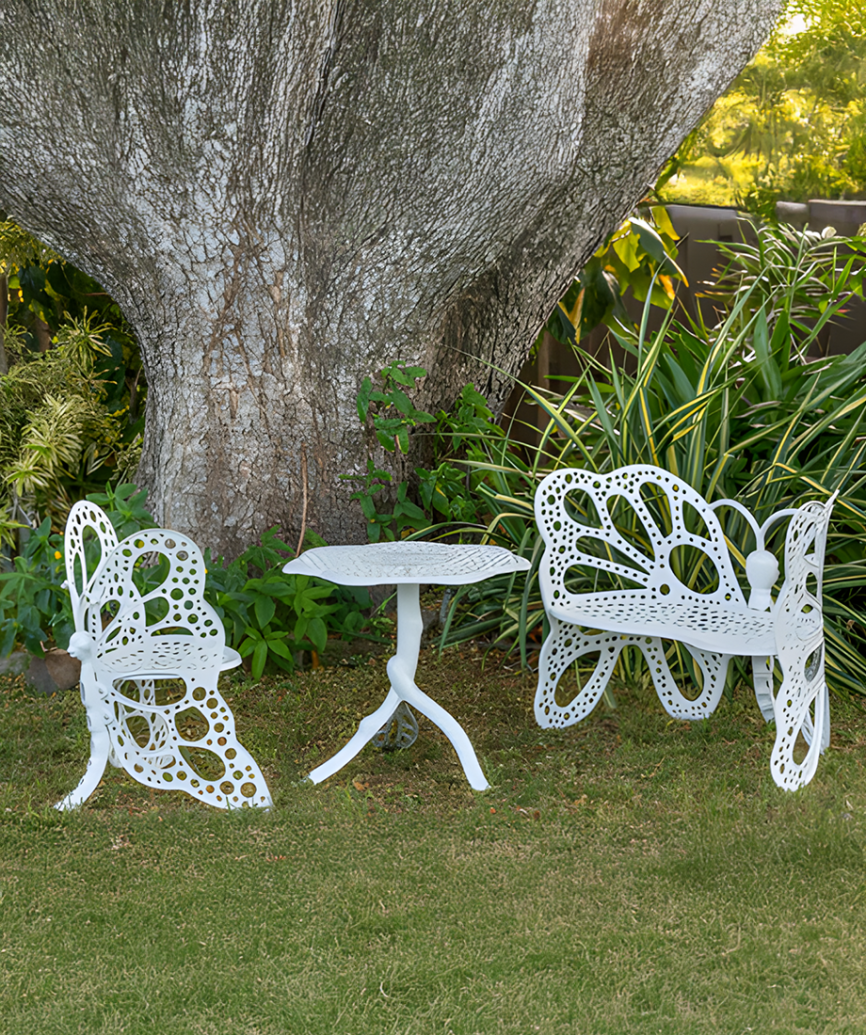 FlowerHouse Butterfly Garden Set in white featuring a table, chair, and bench with a classic wrought iron-inspired design and durable finish.