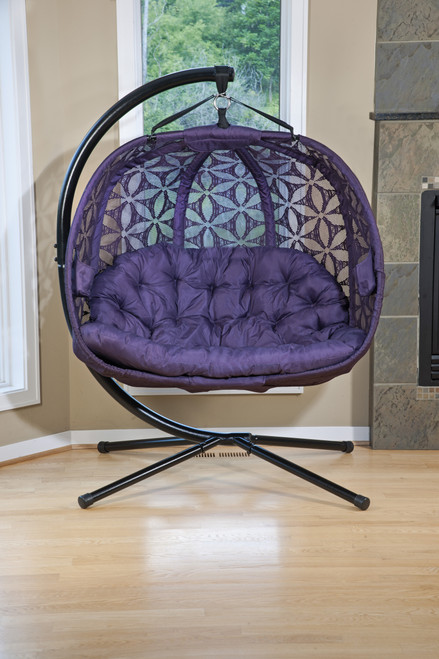 FlowerHouse Hanging Pumpkin Loveseat Chair with Stand featuring a distinctive pumpkin-inspired design and plush, cushioned seating.